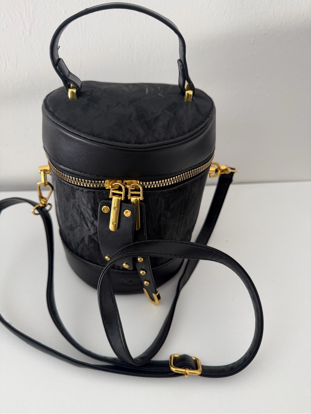 Black Cylinder Crossbody Bag with Gold Hardware